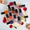 Xprss Nail Polish collection with multiple colorful bottles arranged with flowers and candles